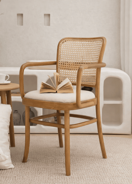 Alfred dining chair with armrests and rattan woven back