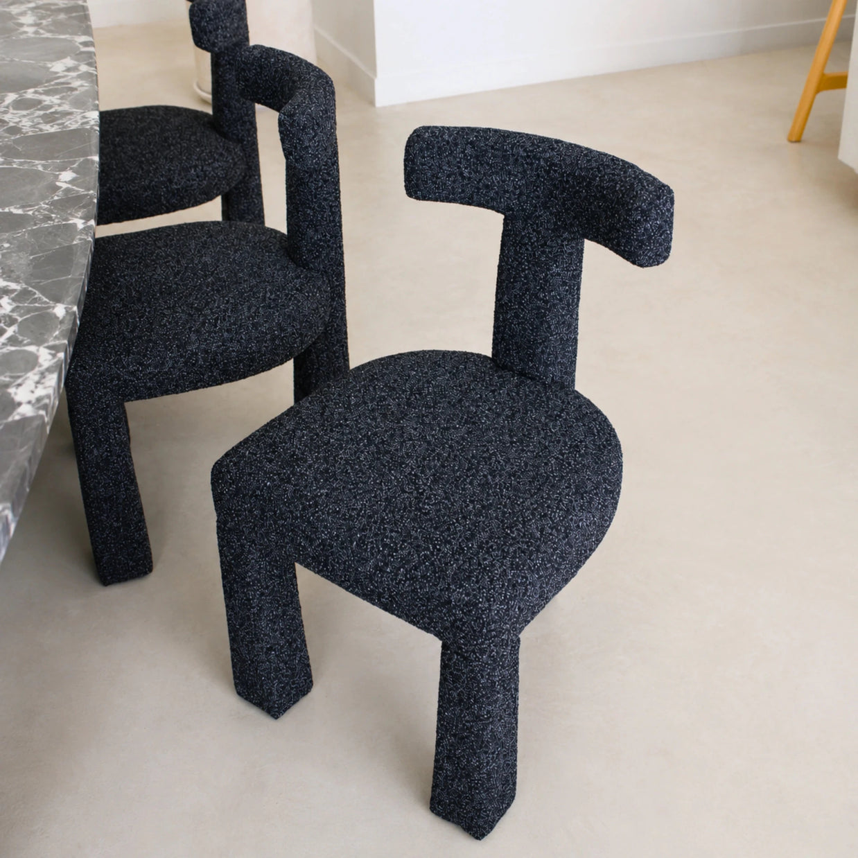 Anne curved dining chair in black and light grey upholstery