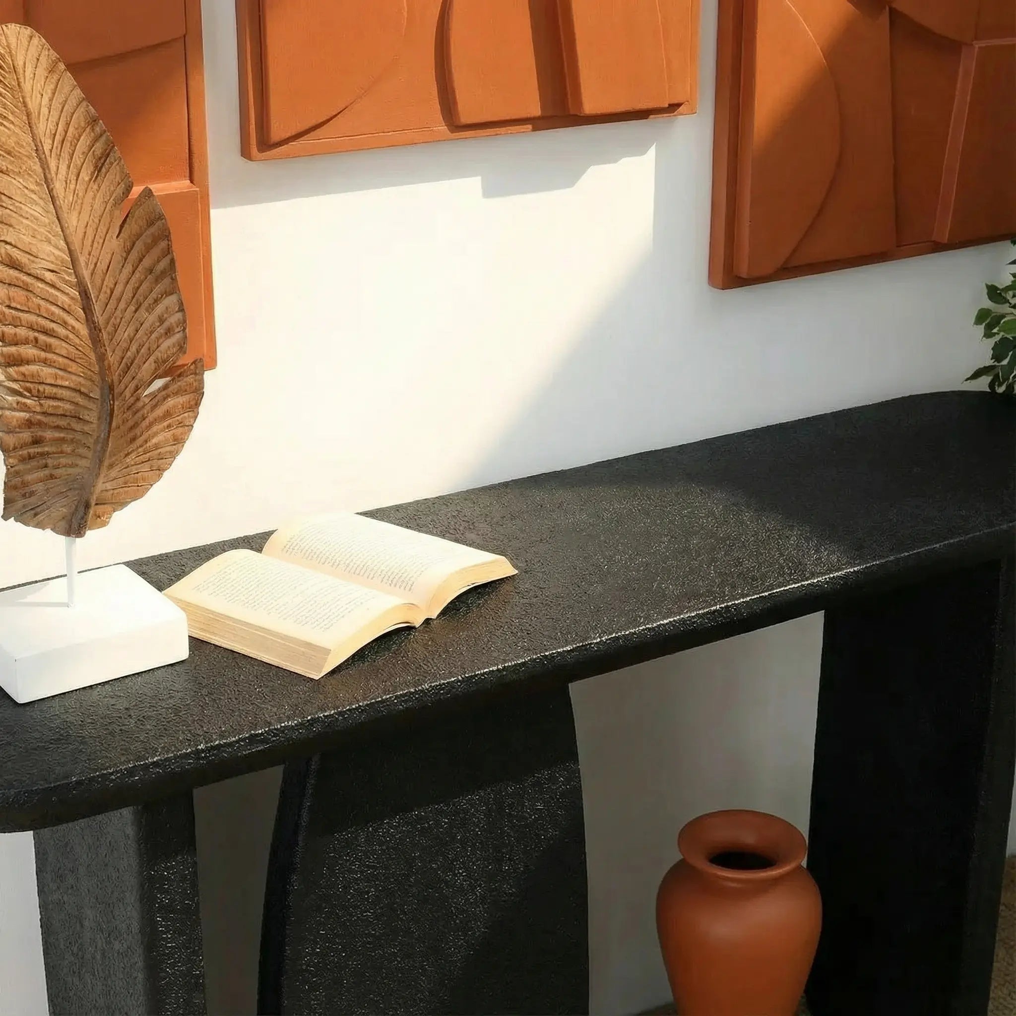 Modern console table with black stone textured finish