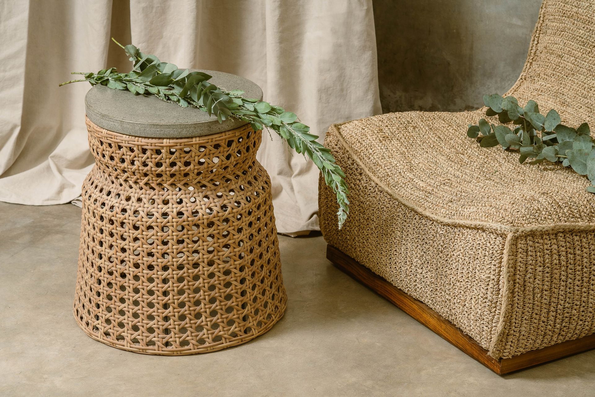 Altos side table in cement and rattan