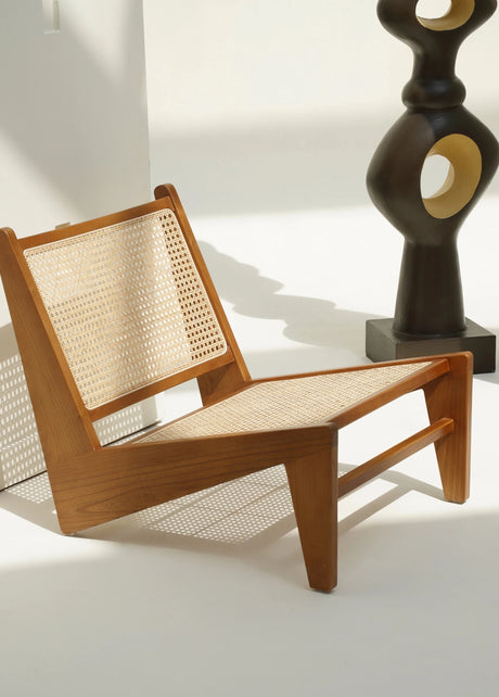 Sukhna low lounge chair in teak wood with rattan weave