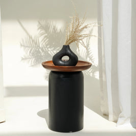 Donald side table with black cylinder base and Suar wood tray top