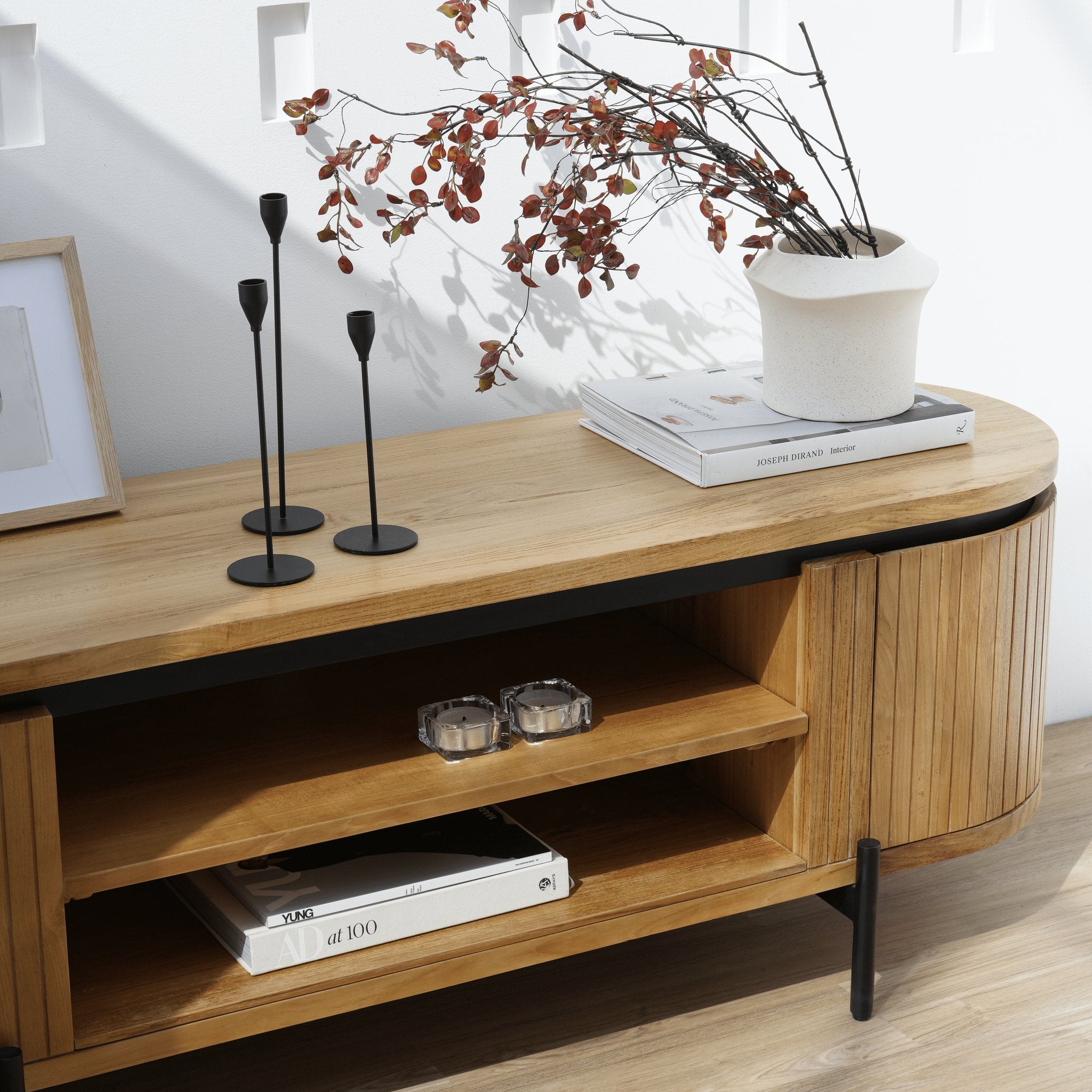 Elegant entertainment unit with side cabinets and front shelving for cable management