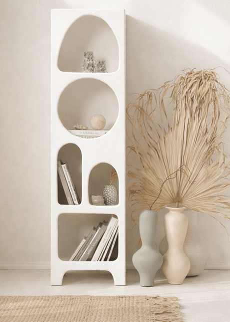 Isabelle bookshelf with textured white finish and cave-like shelves
