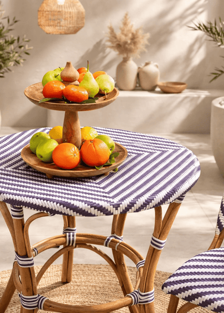 Bistro round outdoor table with synthetic rattan top and cane frame