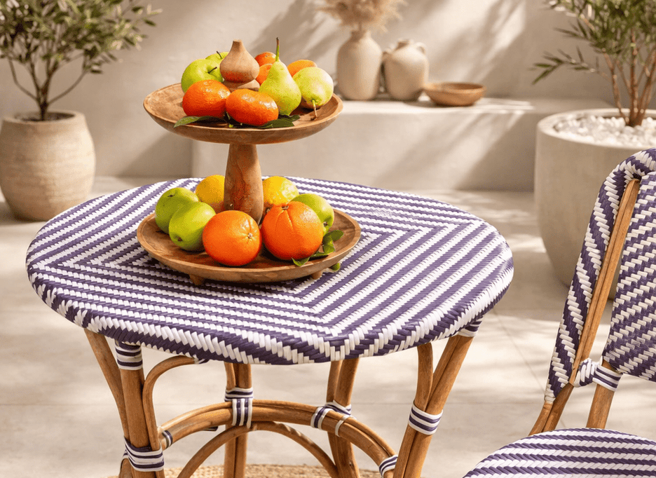 Bistro round outdoor table with synthetic rattan top and cane frame