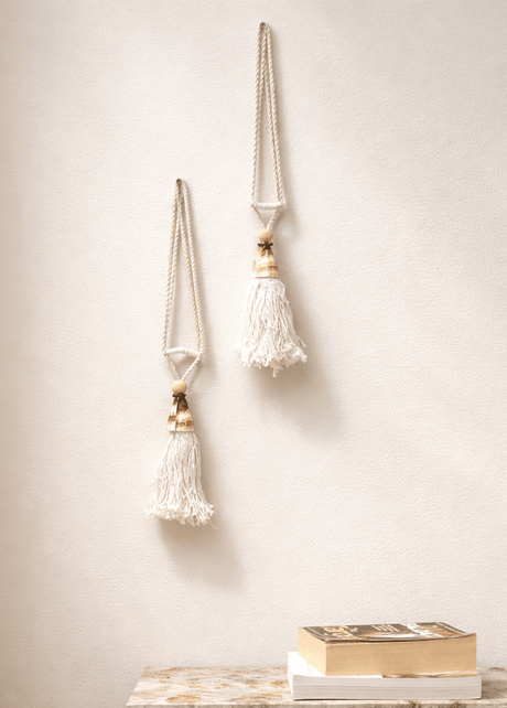 Handcrafted tassel with natural shells and woven yarn